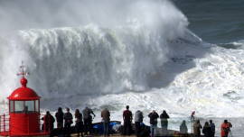 Tourists watching giant waves in Nazare